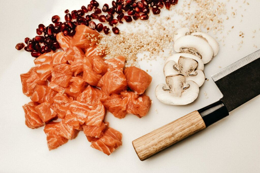 Ingredients for a poke bowl on a chopping board