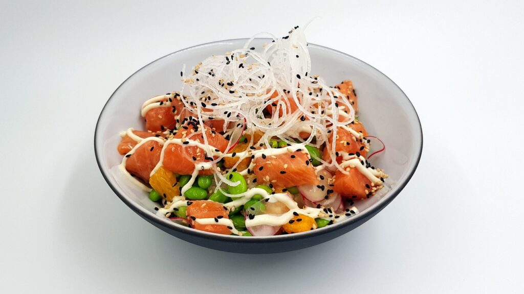 A poké bowl with several toppings