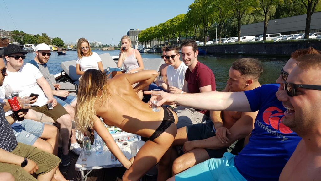 Stripper dancing with on boat with guys during bachelor party amsterdam.